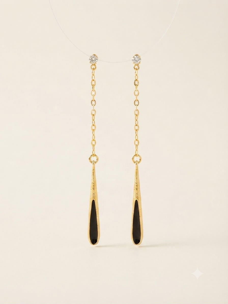 Aretes colgantes dorado con negro elegante