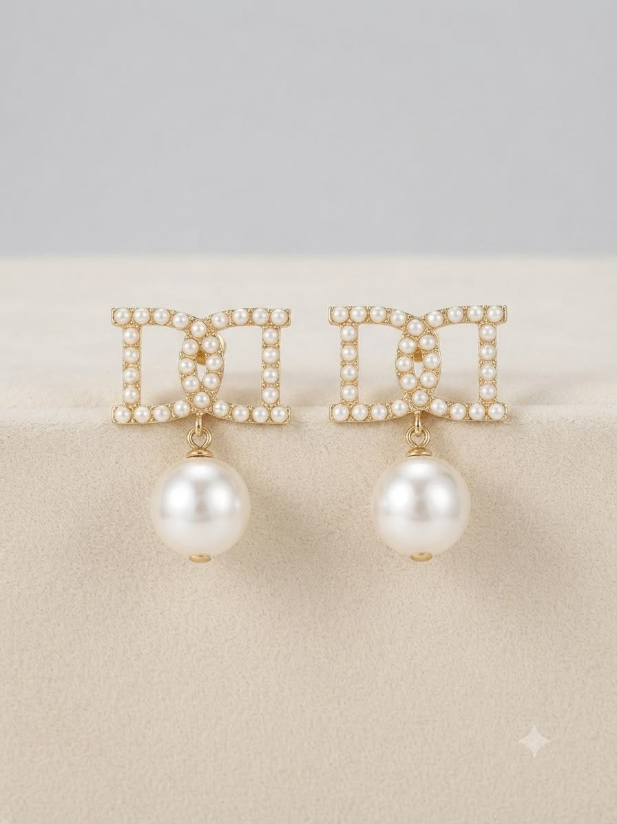 Aretes con perla y detalle de perlas