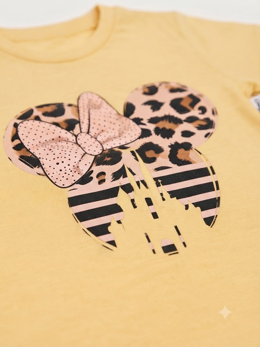 Blusa niña amarilla con estampado con moño y castillo