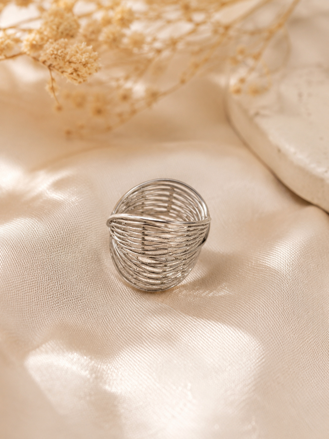 Anillo dama plateado diseño entrelazado