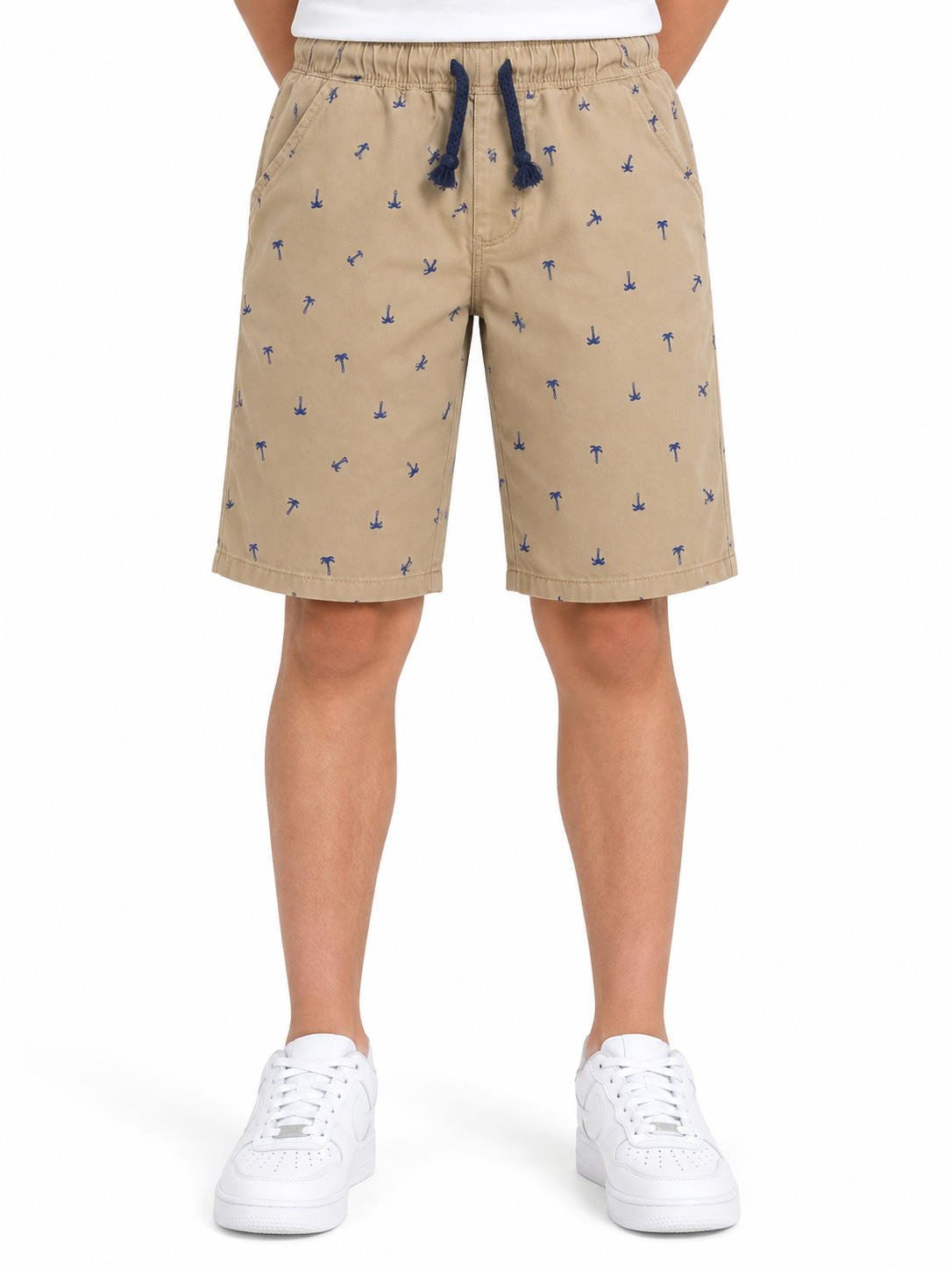 Short niño beige con estampado de palmeras y cintura ajustable