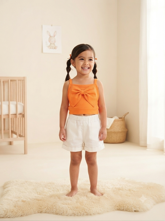 Blusa niña naranja con moño grande