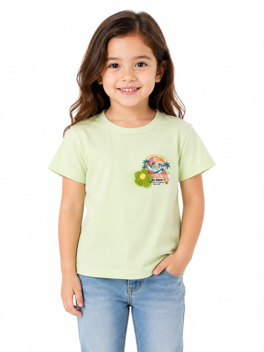 Blusa niña verde claro con estampado tropical y flor