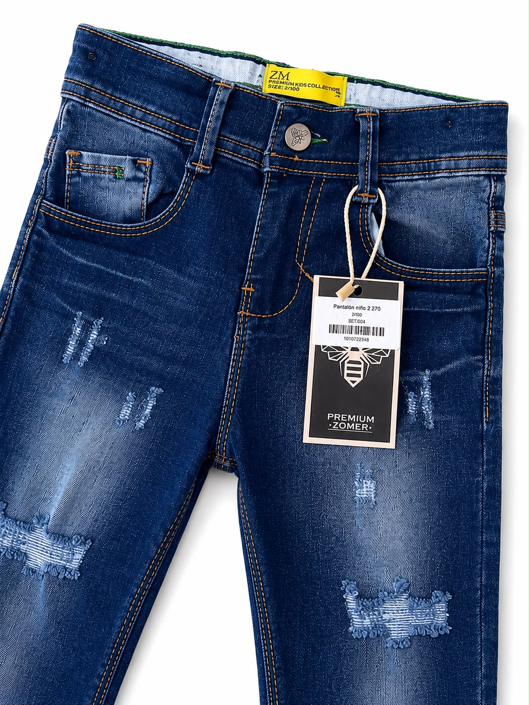 Pantalón niño mezclilla azul con roturas y efecto deslavado
