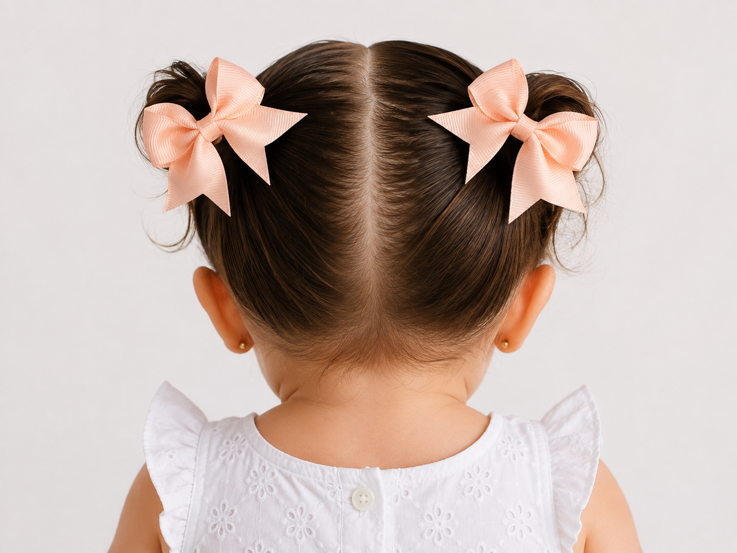 Moño par niña rosa durazno clásico