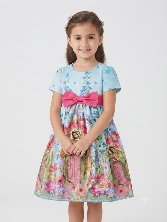 Vestido niña celeste con estampado floral y detalle religioso
