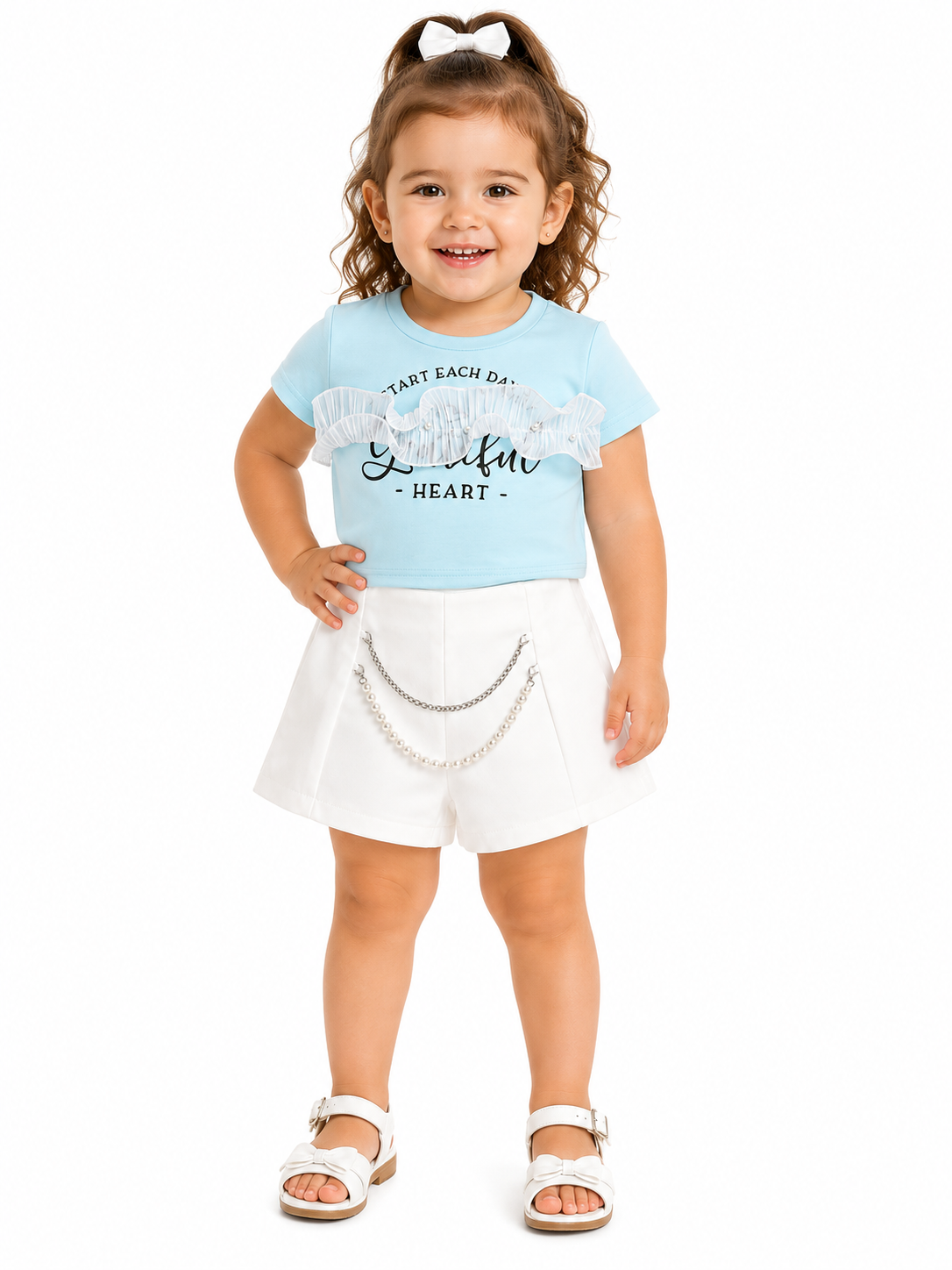 Set niña blusa azul cielo con short blanco