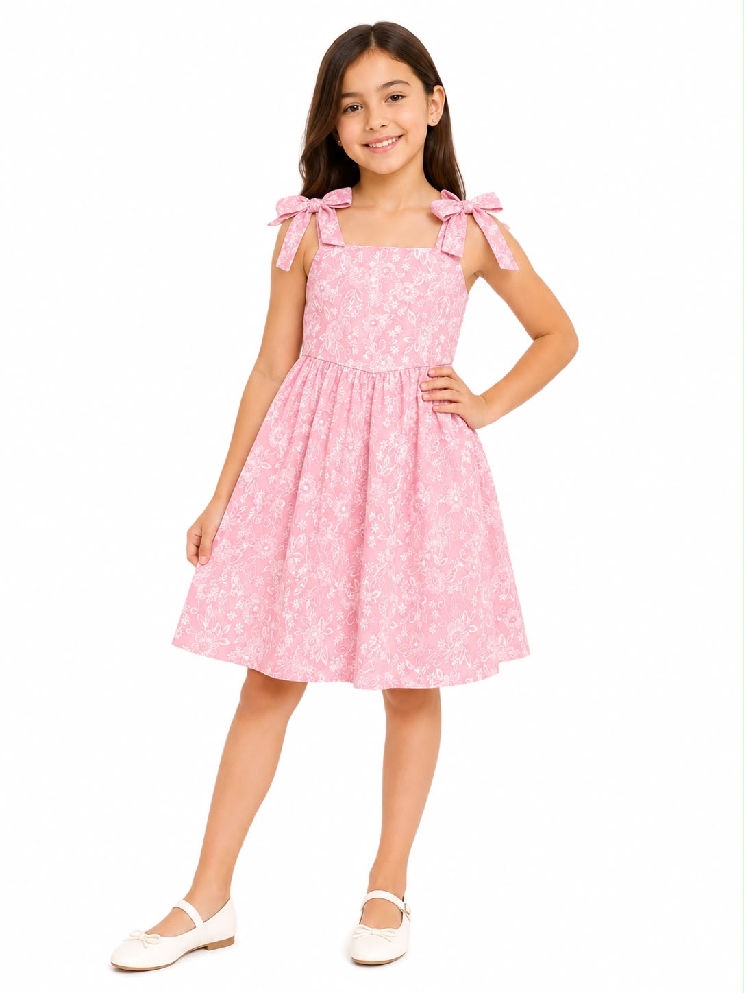 Vestido niña rosa con estampado floral y moños en los tirantes