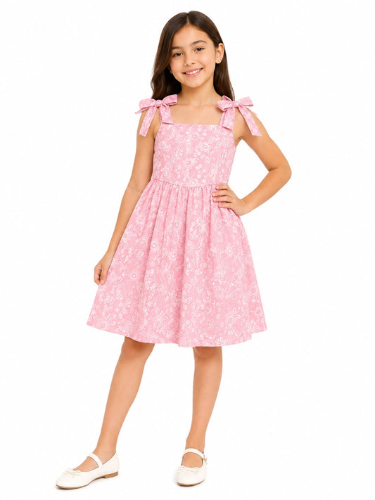 Vestido niña rosa con estampado floral y moños en los tirantes