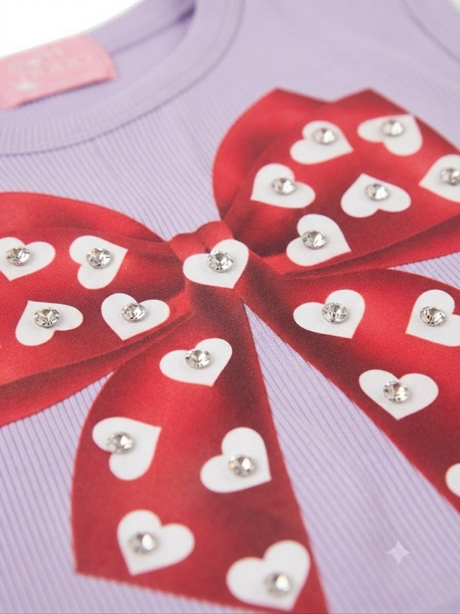 Blusa niña lila sin mangas con moño y corazones
