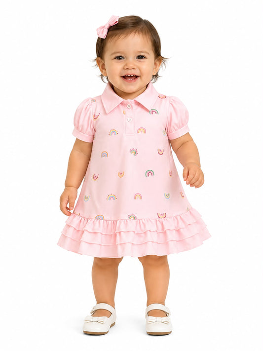 Vestido niña meses tipo polo con estampado de arcoíris – Rosa pastel