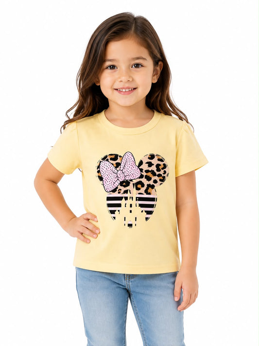 Blusa niña amarilla con estampado con moño y castillo