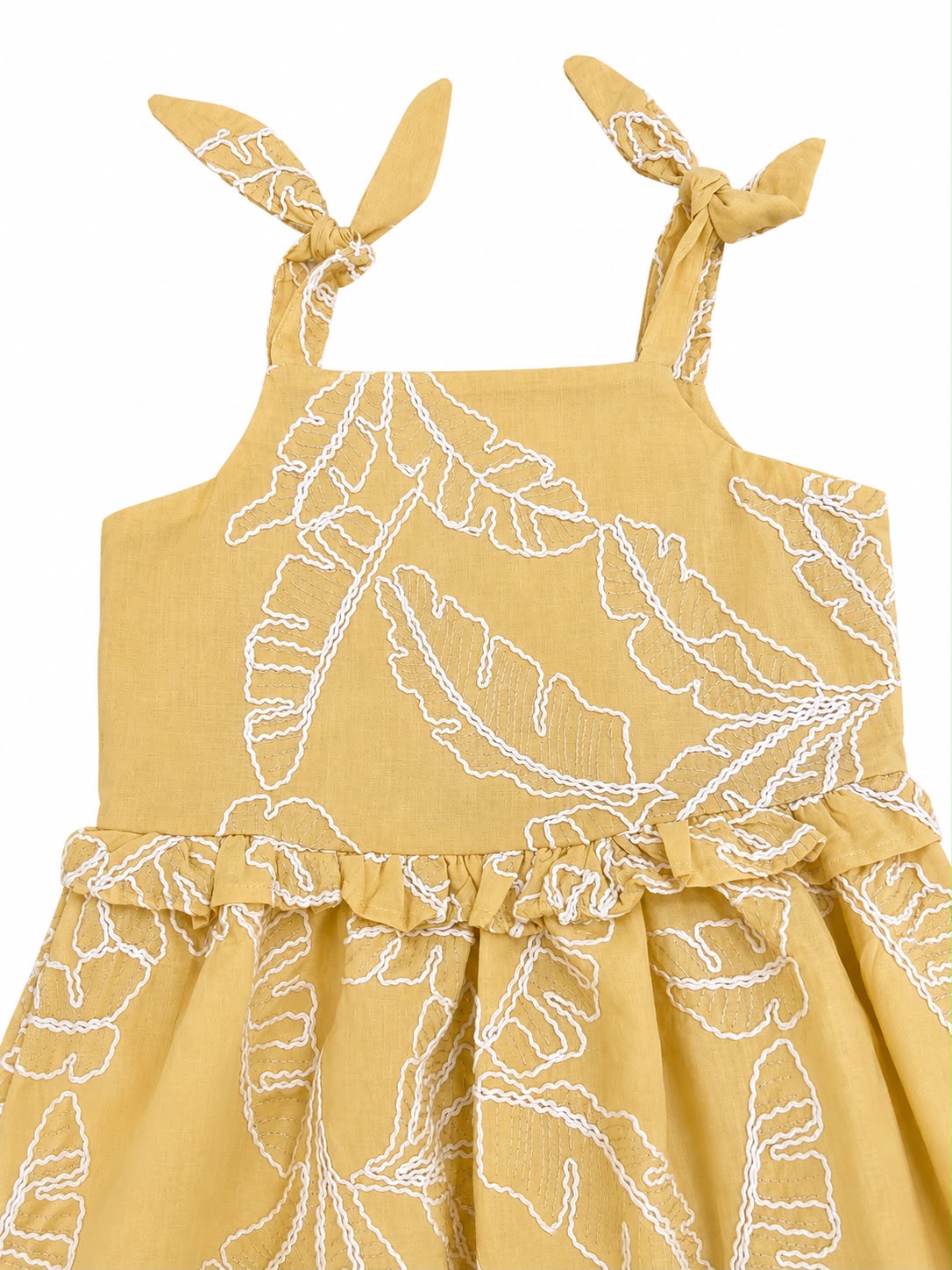 Vestido niña mostaza con estampado de hojas