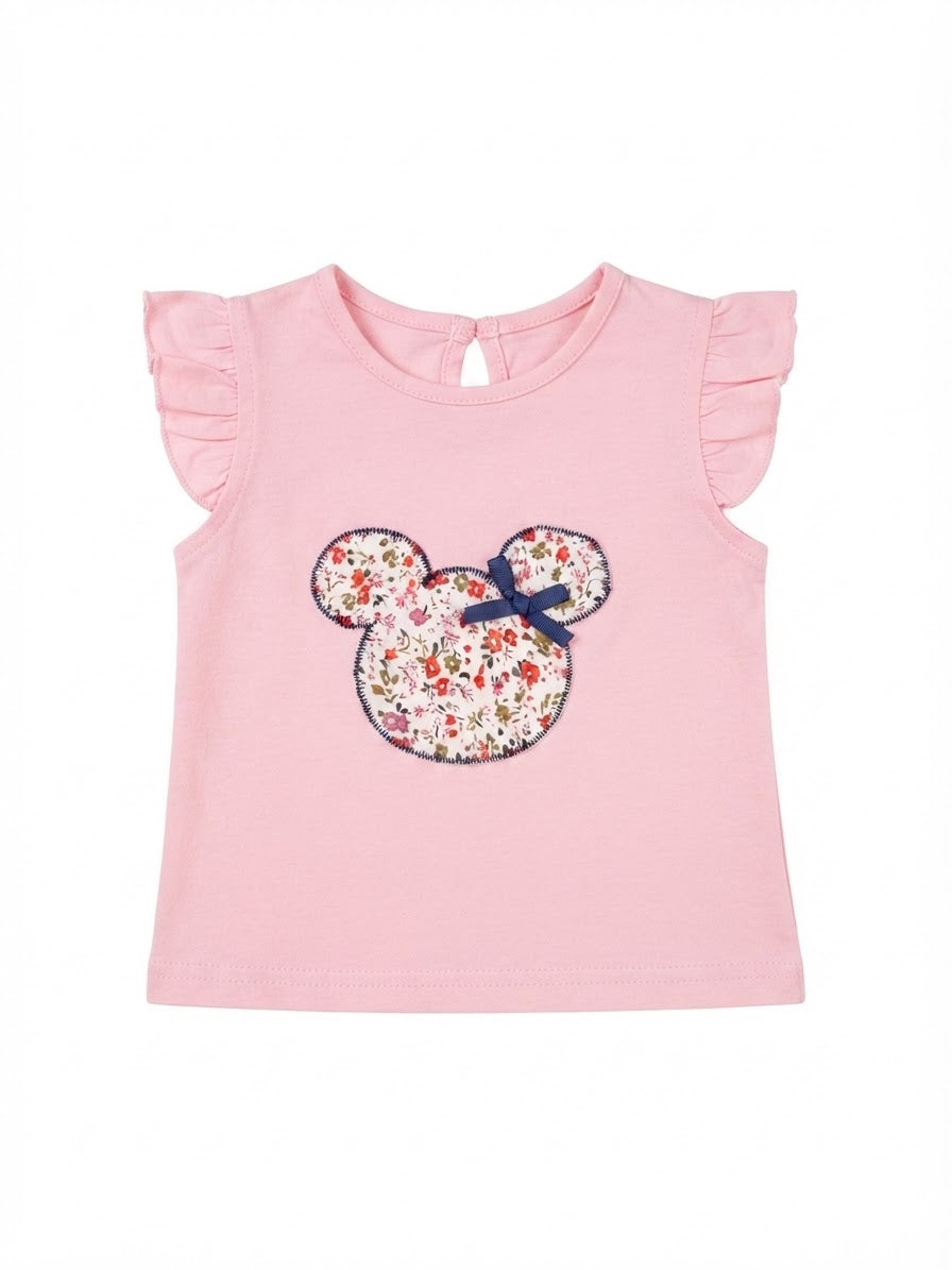 Blusa niña rosa con aplique floral y olanes