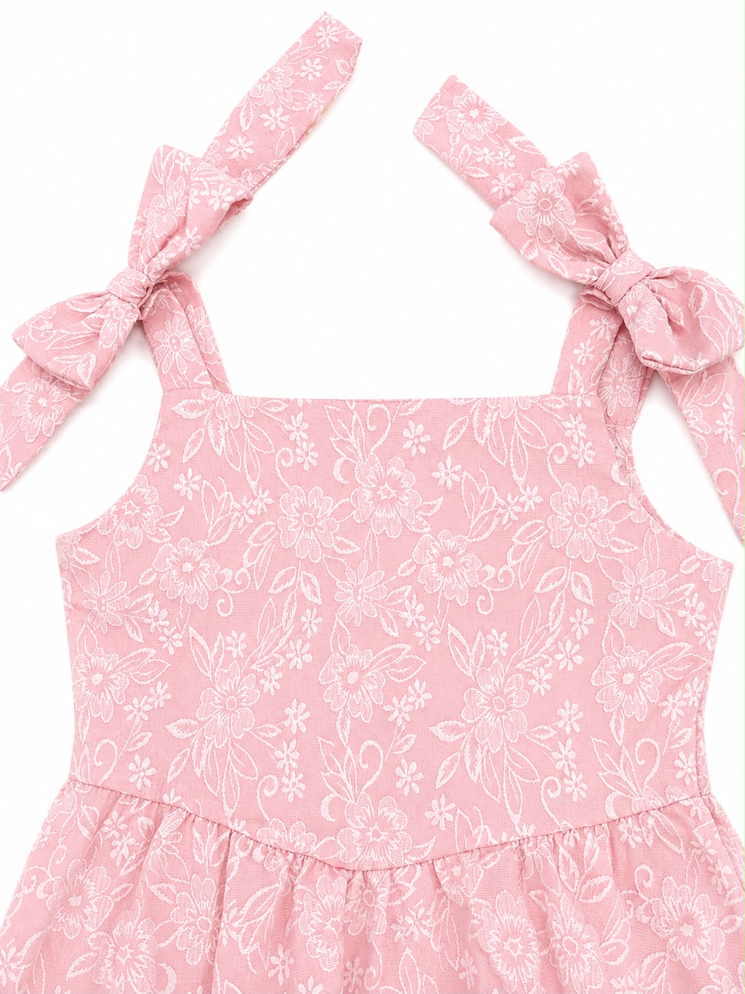 Vestido niña rosa con estampado floral y moños en los tirantes