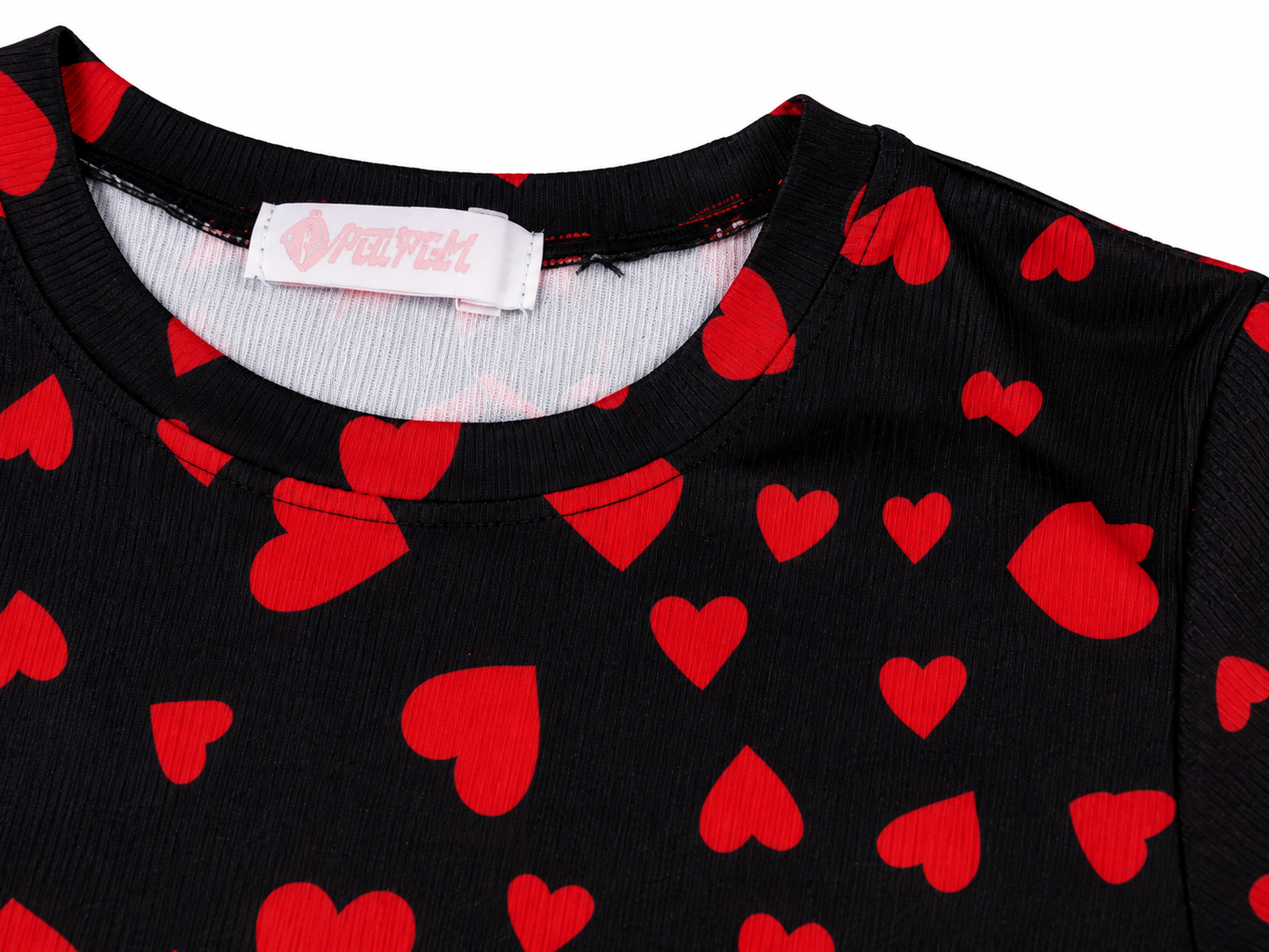 Blusa niña estampado corazones fondo negro