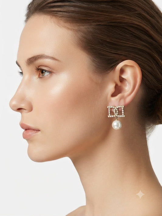 Aretes con perla y detalle de perlas