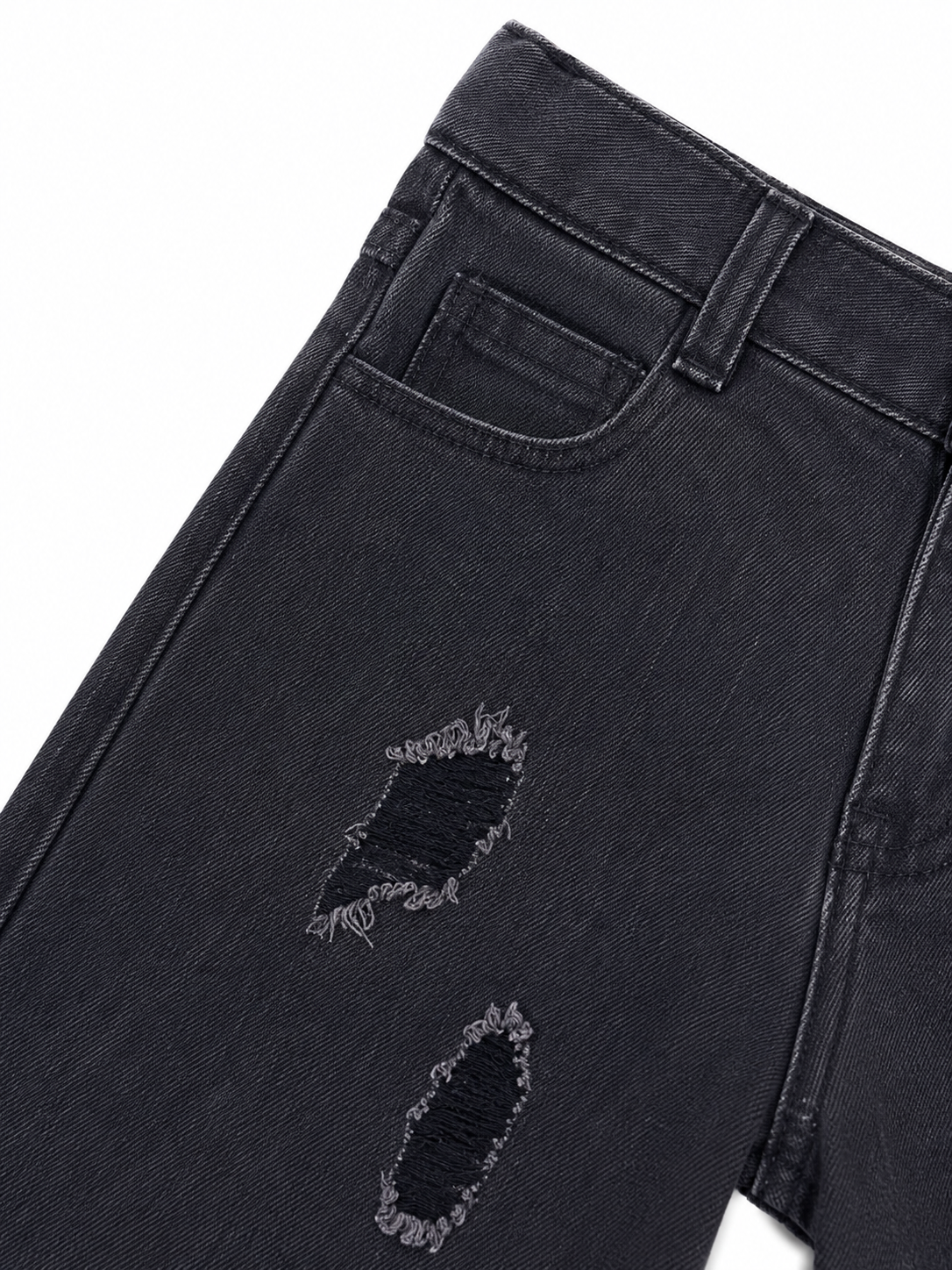 Pantalón niño mezclilla negra con diseño desgastado