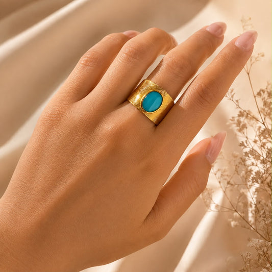 Anillo Dama dorado con piedra turquesa