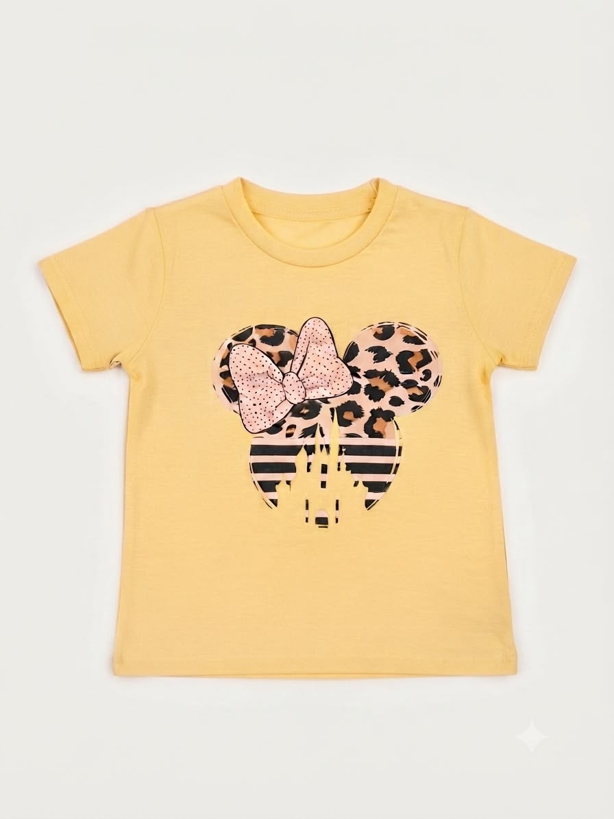 Blusa niña amarilla con estampado con moño y castillo