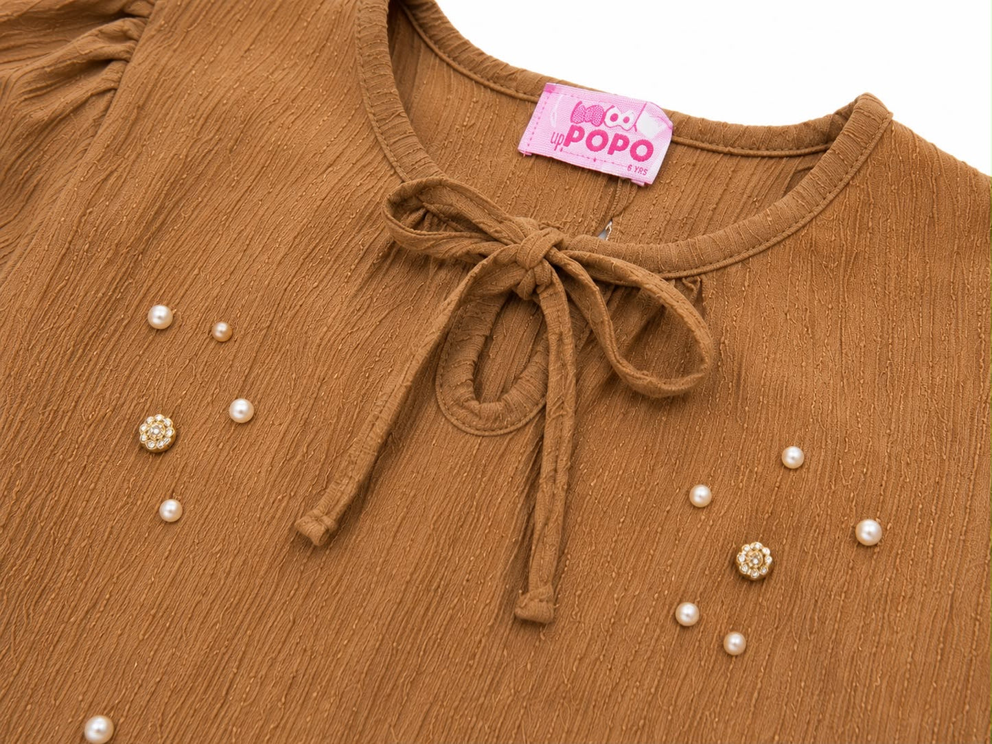 Blusa niña café con perlitas y moño lindo