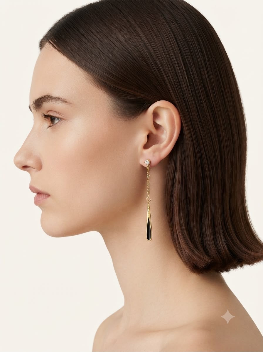 Aretes colgantes dorado con negro elegante