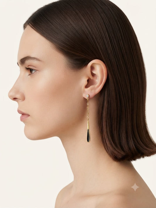Aretes colgantes dorado con negro elegante