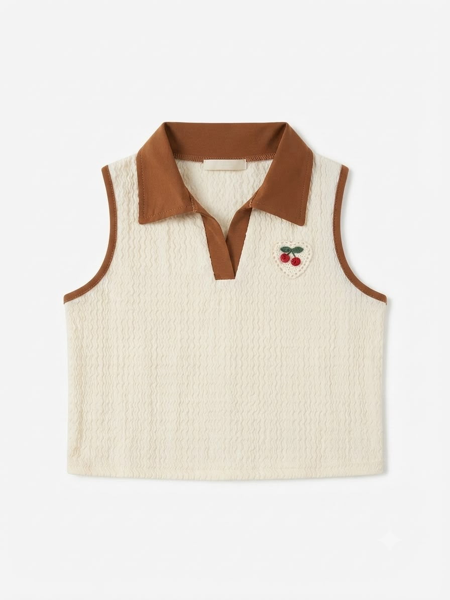 Set niña blusa tejido y falda plisada café beige