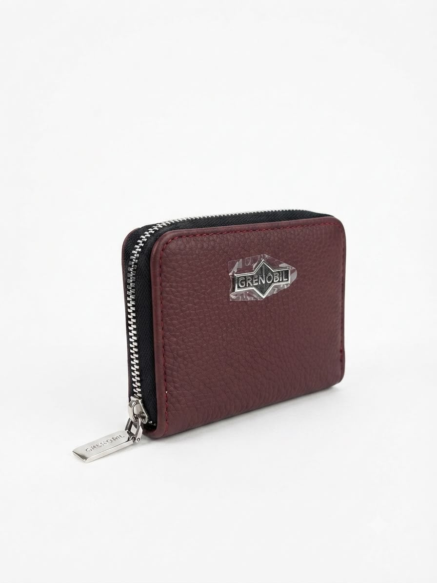 Cartera Damacompacta color vino