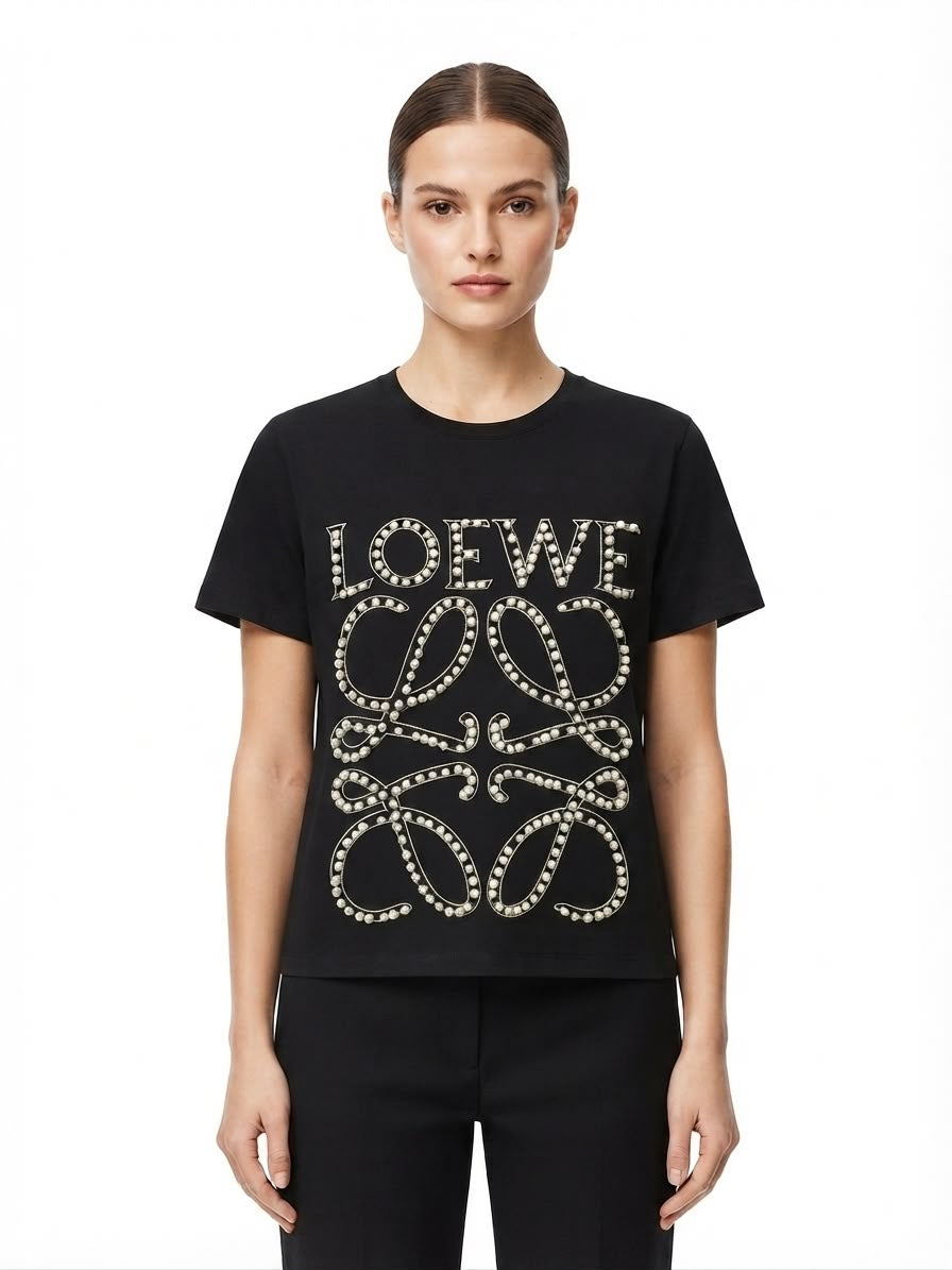 Blusa dama negra con diseño de moños y detalles brillantes