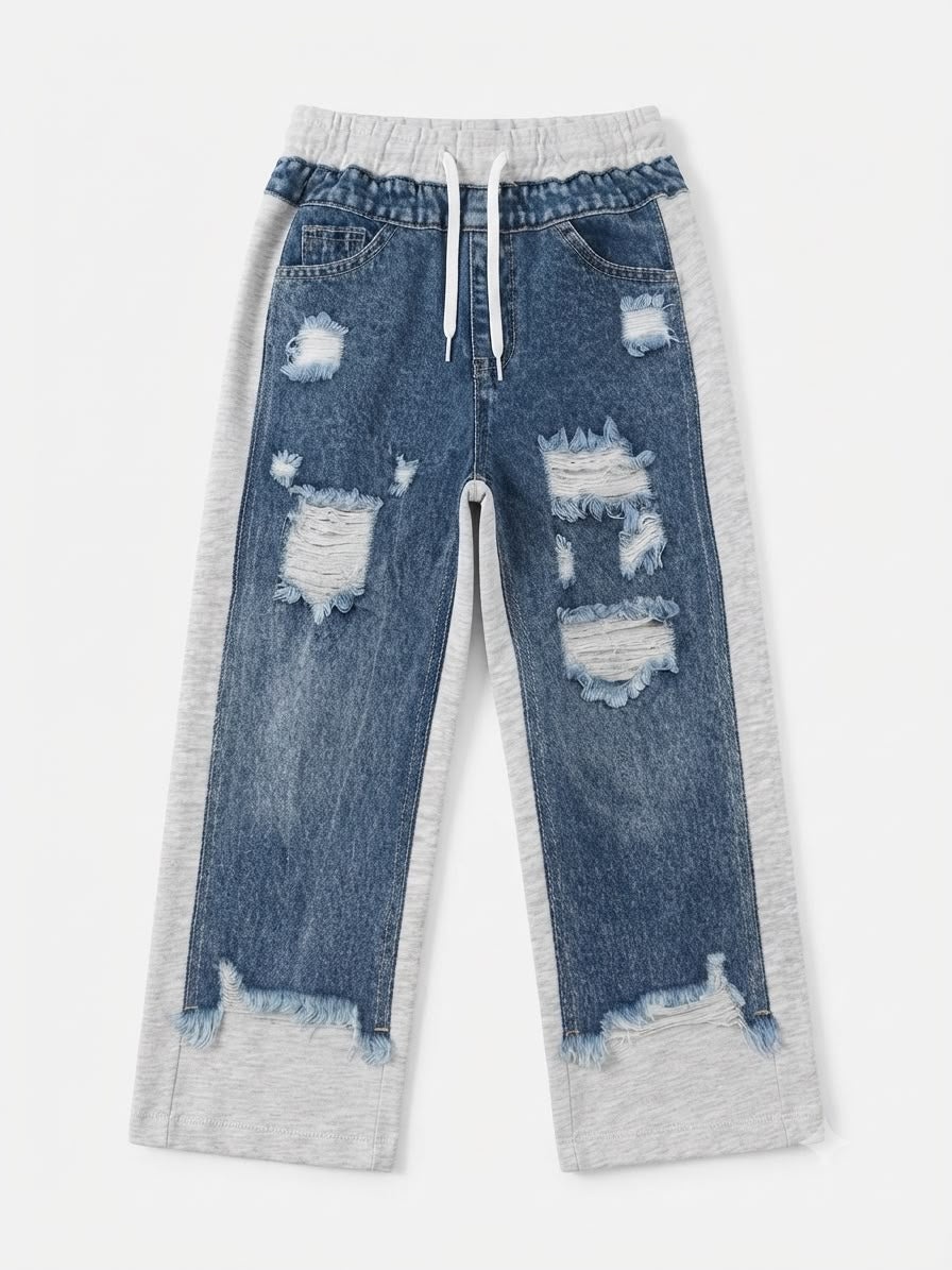 Pantalón niña jogger de mezclilla con detalles desgastado
