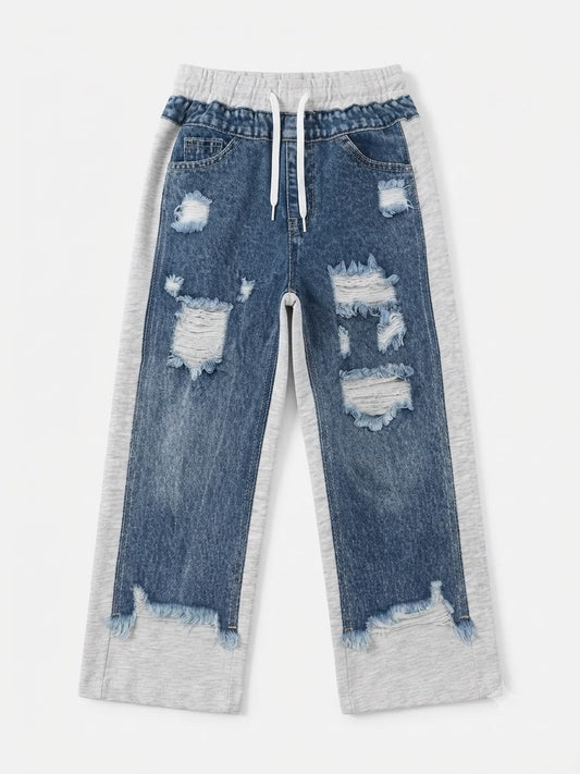 Pantalón niña jogger de mezclilla con detalles desgastado