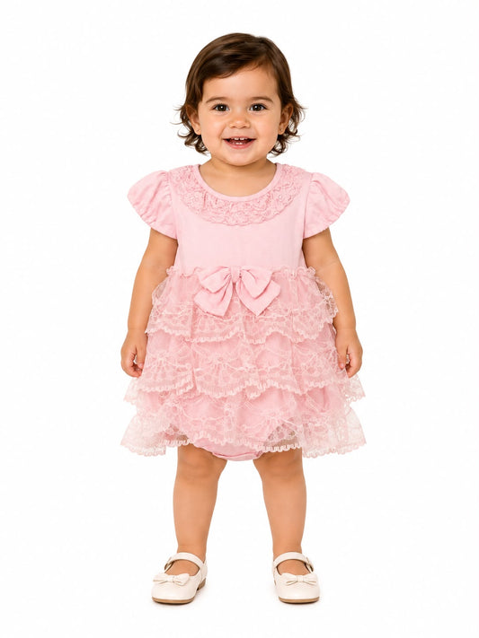 Vestido niña con encaje y moño rosa