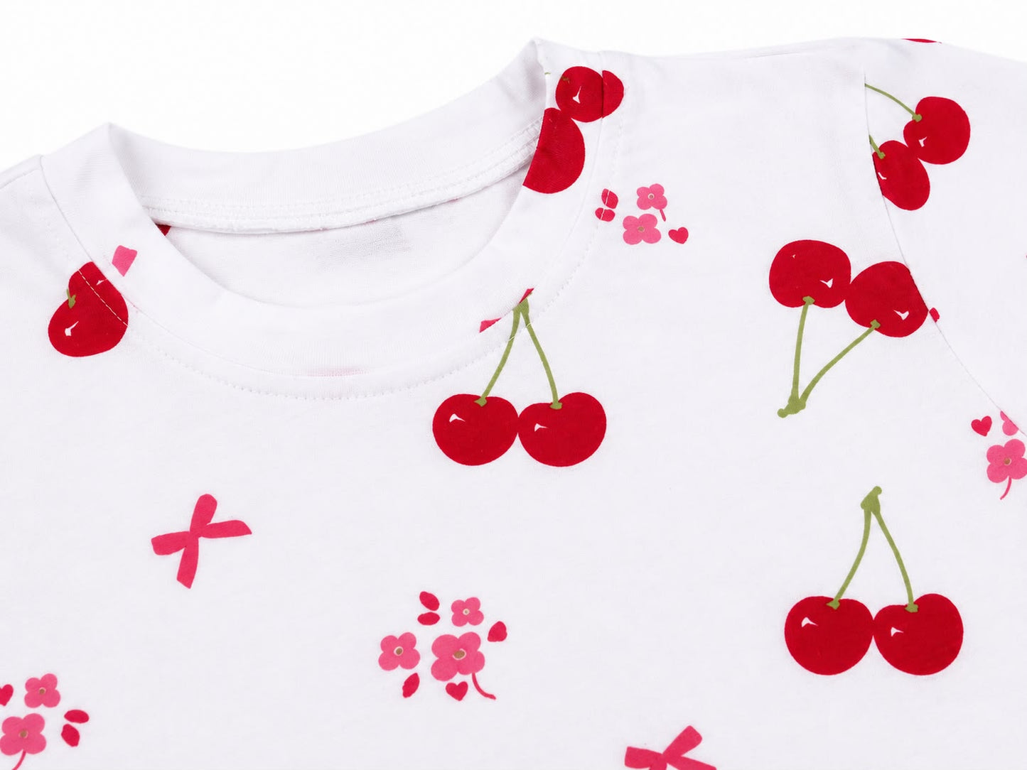 Blusa niña blanca con estampado de cerezas